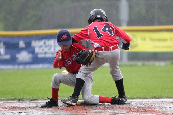 The final game of the 8th Annual Majors Baseball Tournament held at Myrtle Park on Monday was extremely wet. Despite torrential down pours, delays of game where there was a little dancing involved, constant water drainage and soaked players and coaches the Mt. Seymour Red Sox and The Hastings Red Sox played through.