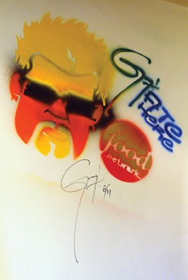 Host Guy Fieri left his mark on the eatery's wall.