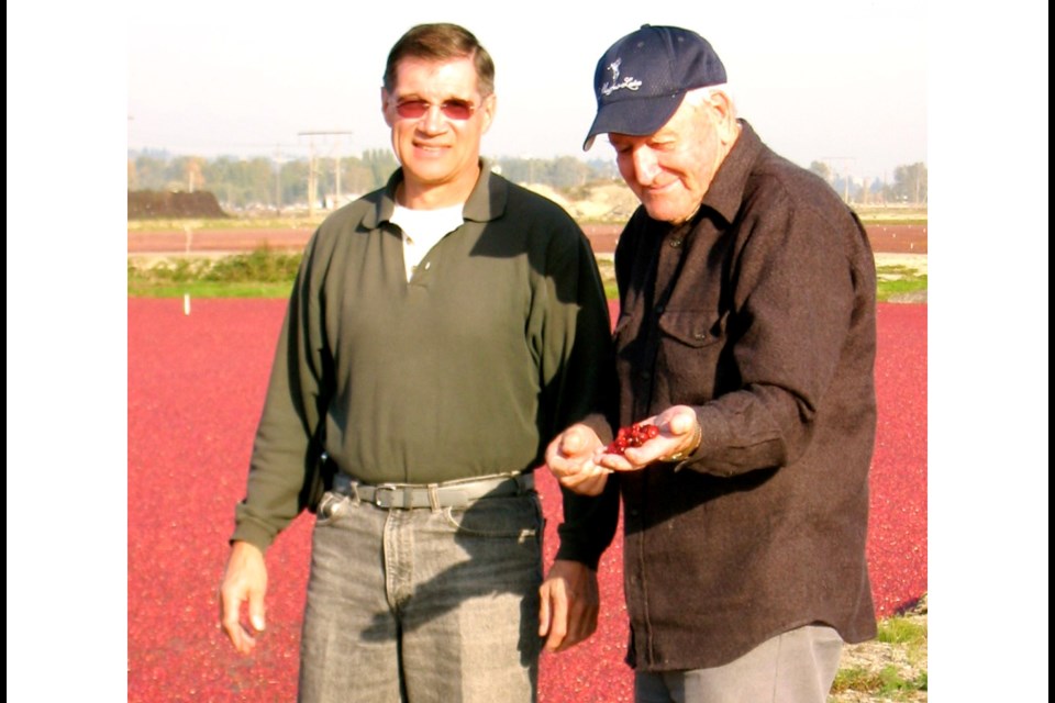 Rick May and his father Godfrey 'Buck' May in an undated photo at one of the May Family's cranberry bogs.