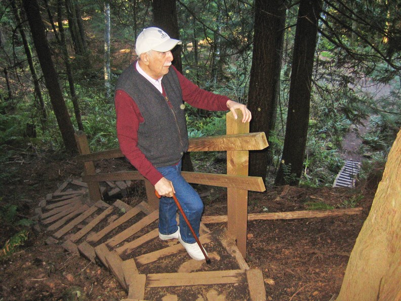 Diego, age 96, scales the stairs to the top of Soames Hill.