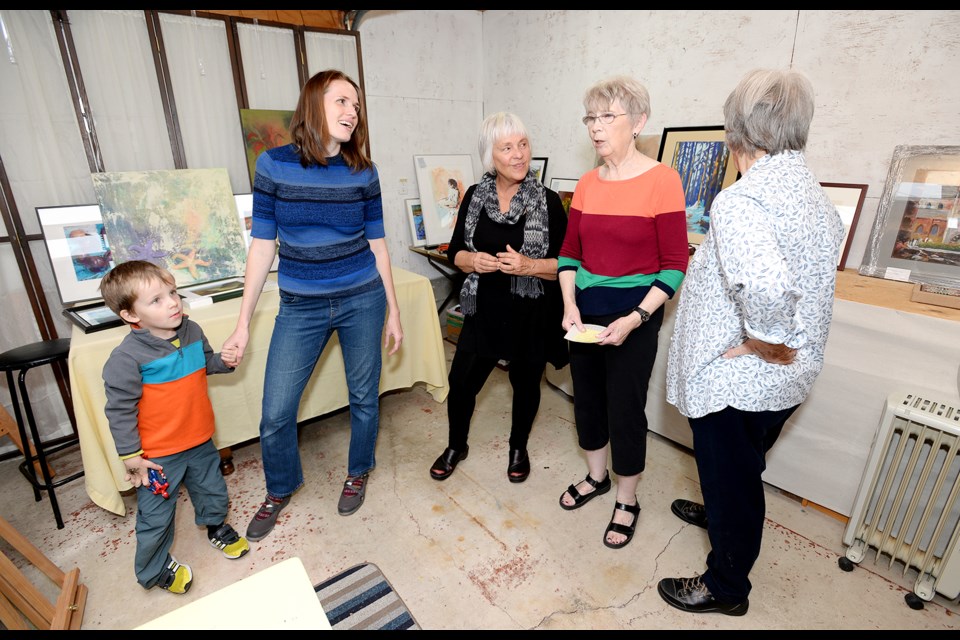 Kira Sokolovskaia, Dianne Yard, Sheila Chowdhury and Pat Sexsmith discuss plans for the Gamma Garage art show, coming this weekend to 232 North Gamma Ave.