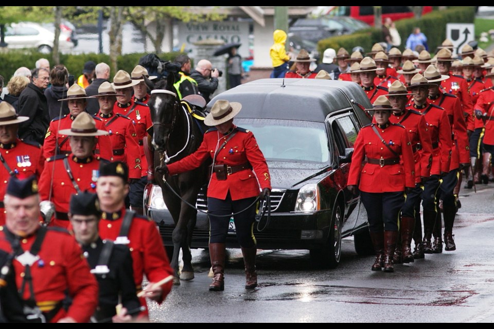 Mounties in accompany the hearse carrying West Shore RCMP Const. Sarah Beckett to the Q Centre arena for her funeral in Colwood on Tuesday, April 12, 2016.
