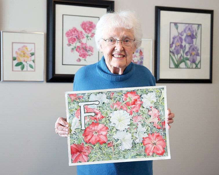 Doris Dittaro stands in her home studio on Saturday, while holding her contribution to the Alphabet Project, the Letter F. Citizen Photo by James Doyle      April 9, 2016