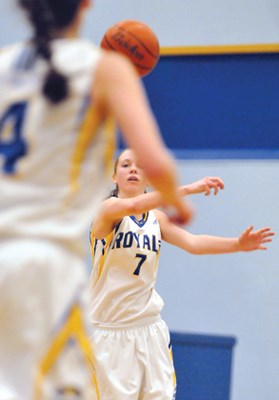 Elisa Homer (left) of the Handsworth senior girls basketball team takes a pass from teammate Abby Dixon in the team's 83-66 win over Argyle in the North Shore AAA final Thursday. The dynamic backcourt duo combined to score 62 points for Handsworth in the win.