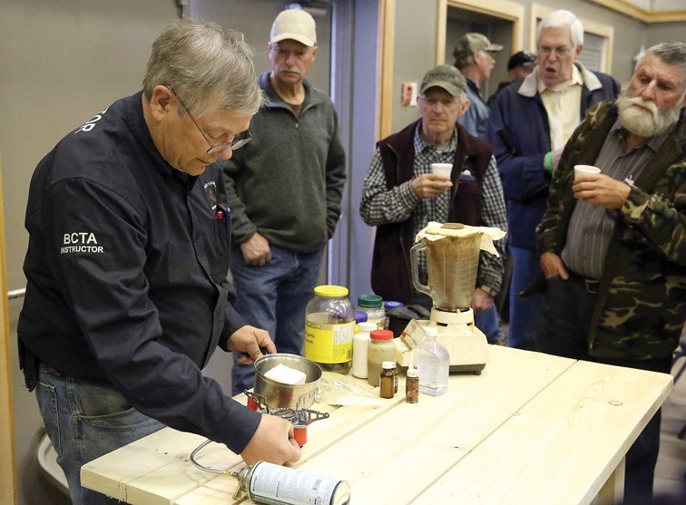 BC Trappers Association instructor Stu Maitland demonstrates how to make a scent to attract a lynx on Saturday at the 71st B.C.T.A. Annual General Meeting & Convention that was held in Prince George this past weekend at the Columbus Community Centre. Citizen Photo by James Doyle april 16, 2016