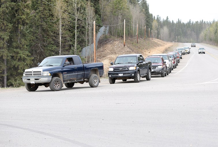 Vehicles line Foothills Boulevard on Sunday as they wait to get into the Foothills Landfill. For a donation of one non-perishable food item, people were able to get a load of compost from the landfill. All food items donated will go the the St. Vincent de Paul Society. Citizen Photo by James Doyle April 17, 2016