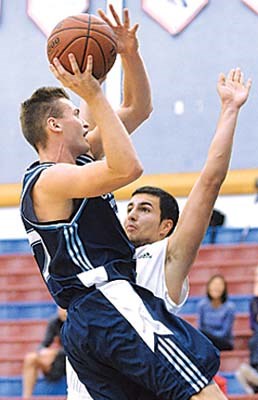 Capilano Blues Men's basketball game against St. Clair during Caps Blues Classic Tournament over the weekend of Oct. 5, 6 & 7. #7 Vincent Selina being checked by #33 Matei Nuna.