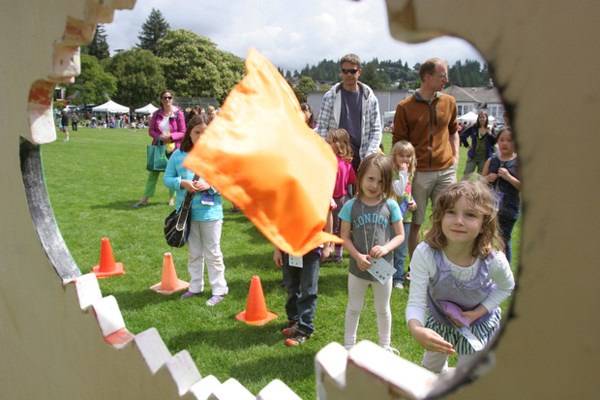 Sarah McDonald tosses a beanbag at Hollyburn elementary's family-friendly centennial event June 2. The school invited the community in for the day to help celebrate West Vancouver's 100-year anniversary.