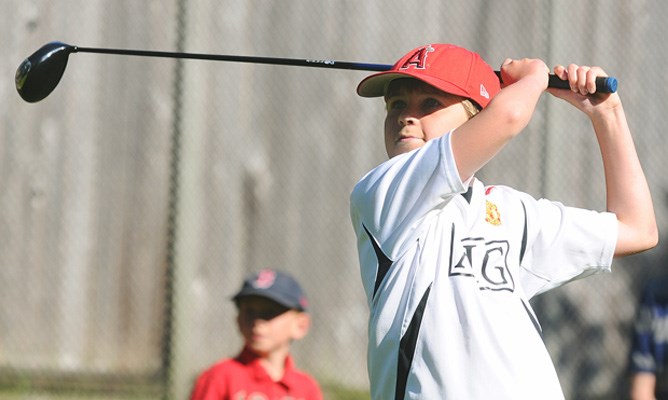 Joshua Jackson, age 11, tees off during the tournament July 28th.