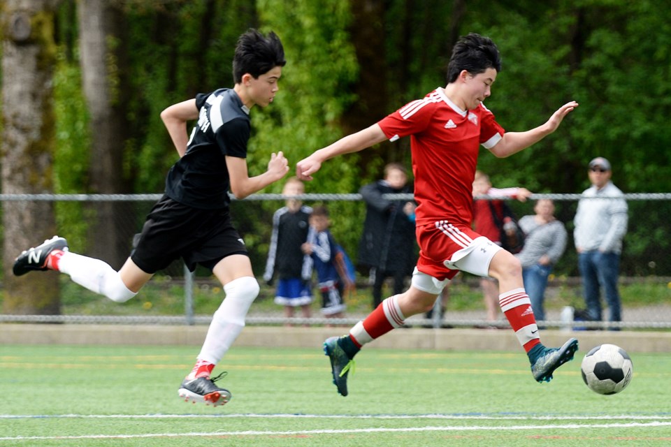 Burnaby u15 FC's Richard Culleton, at right, prepares to unleash a shot during last week's Coastal A Cup semifinal.