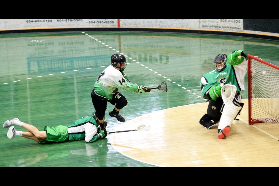 Burying one off a breakaway, Burnaby Lakers’ Josh Dumont, centre, beats Victoria Shamrocks netminder Spencer Erwin with his first of two on the day Sunday in an intermediate A game. The Lakers scored first but played catch-up most of the day in a tight 10-9 loss at the Bill Copeland Sports Complex.