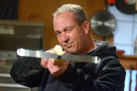 Burnaby craftsman Jeff Davidson takes aim with a marshmallow-shooting crossbow he designed and produces in a rented Burnaby garage. The novelty weapons were a big hit at the B.C. Rod and Gun Show in Cloverdale earlier this month.