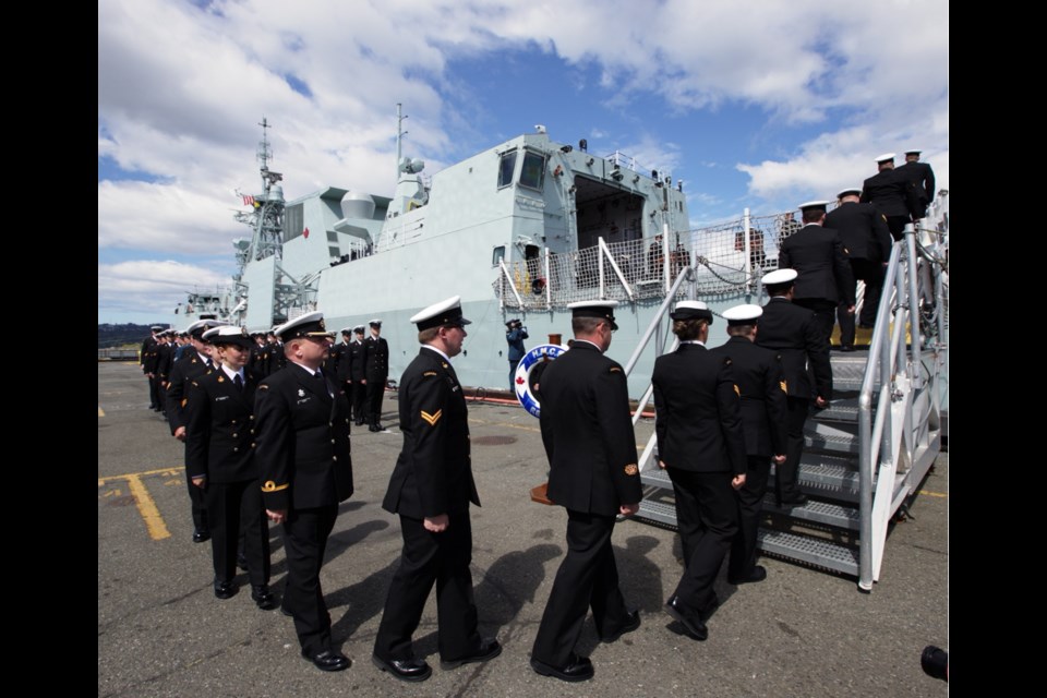 The crew of HMCS Regina return to the ship after its redeployment at CFB Esquimalt on Friday, April 29, 2016. The ship underwent a one-year refit.