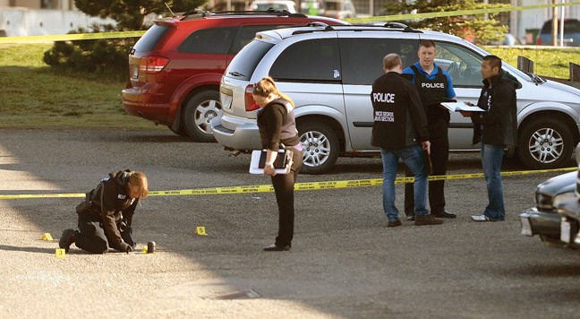 Police on the scene of a shooting at 17th Avenue and Spruce Street Friday morning. A male was shot in the parking lot. He survived the shooting and was taken to hospital. Citizen photo by Brent Braaten April 29 2016