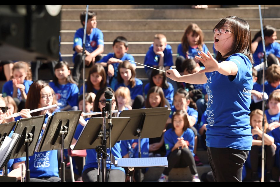 Argyle secondary band teacher Diana Chan conducts her students at a free public concert Monday morning at Robson Square as part of the 12th annual Music Monday. The performance was part of a nation-wide event supporting music education. Photo Dan Toulgoet