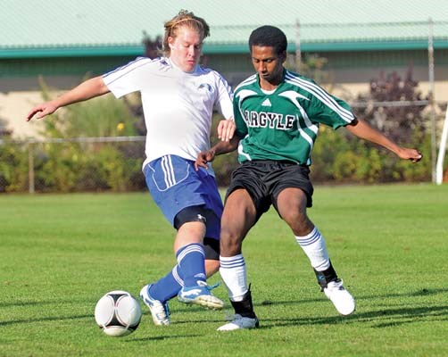 Argyle (green) and Handsworth senior boy's soccer action at Lynn Valley park.