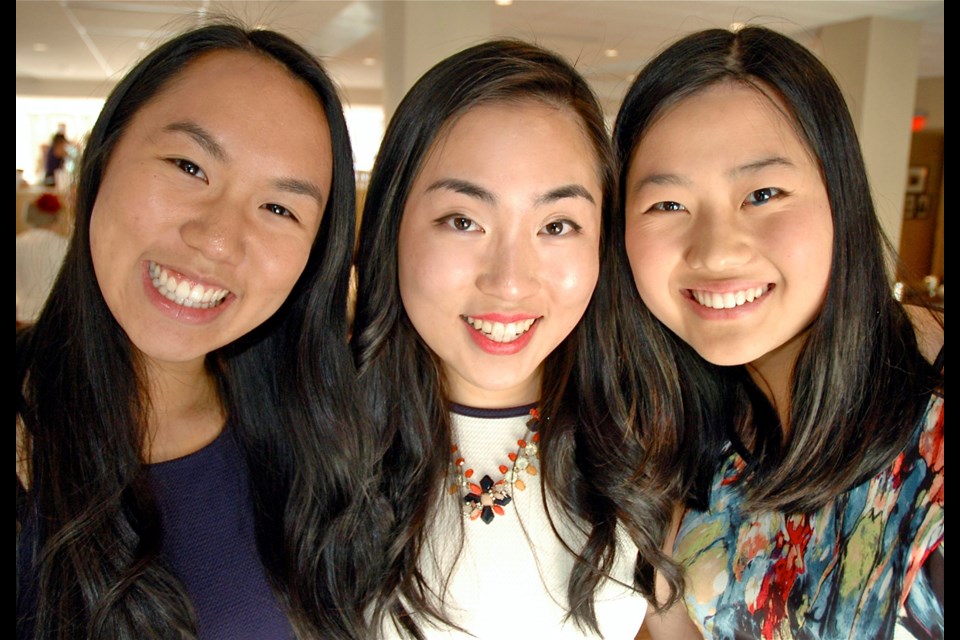 Vancouver Soroptimist Vivian Tsang, centre, presented Karmen Leong, left, and Alice Xu with the Soroptimist Violet Richardson Award for their volunteerism efforts to make the community and world a better place.