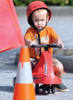 2 year old Cole Webb navigates a bike safety course.