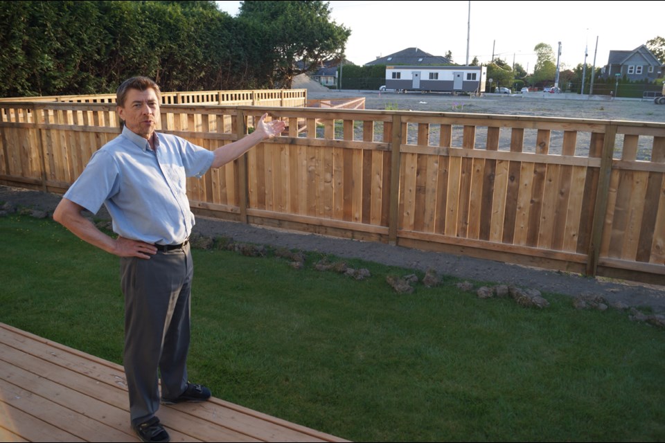 Seafair resident Jim Barkwell spent an extensive amount of time speaking to planners, developers and politicians to ensure a development behind his house, along an arterial road, would not be too imposing on his property. Photo by Graeme Wood/Richmond News