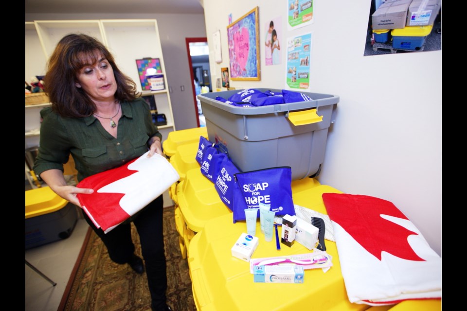 Anne McIntyre of Disaster Aid Canada with supplies to be sent to Alberta.