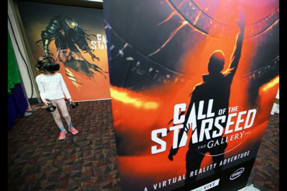 Kaitlyn West, 8, plays Call of the Starseed at the DigiBC Conference at the Victoria Conference Centre on Wednesday.