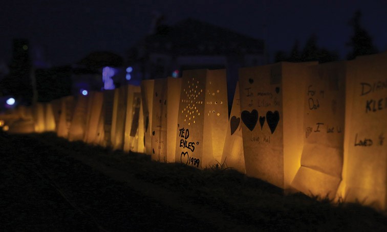 Luminary bags line the track at Masich Place Stadium on Saturday at Relay for Life. Each bag represents someone who has lost the battle with cancer. Citizen Photo by James Doyle May 7, 2016