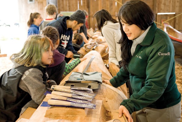 Haida Gwaii Grade 5 students visit the carvers while they work at the Haida Heritage Centre.