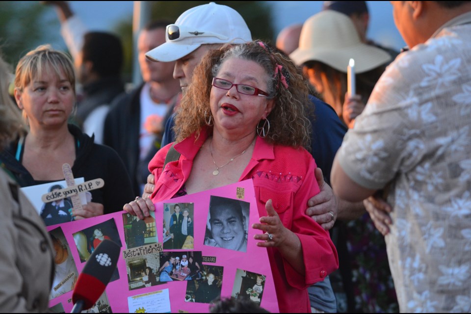 Kim Young speaks to reporters at a vigil in honour of her son Eddie, who took his own life last week shortly after being released from Burnaby Hospital.
