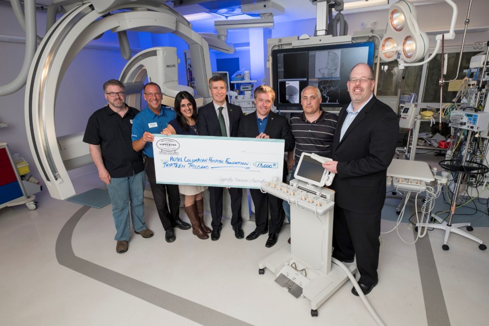 Helping health care: From left, Gordon Hobbis (Caps Bicycle Shop), Michael Huhn (Save-On-Foods), Salima Mawji (Royal Columbian Hospital Foundation), Graeme Atwater (TD Canada Trust), Steve Kasper (Remax), Guy Ciprian (Savi Integrated Marketing) and Brett Pavan (Loren Nancke & Company) recently gathered to present a $13,000 cheque to the Royal Columbian Hospital. The funds were raised at last year’s Sapperton Day Street Festival.