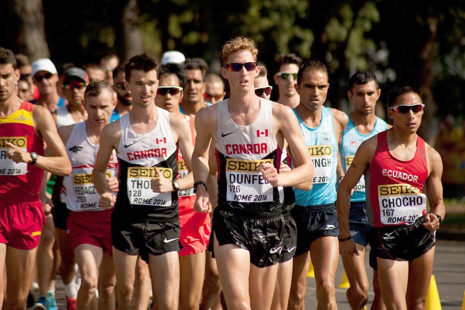 Evan Dunfee leads the congested pack during the 20 km event.