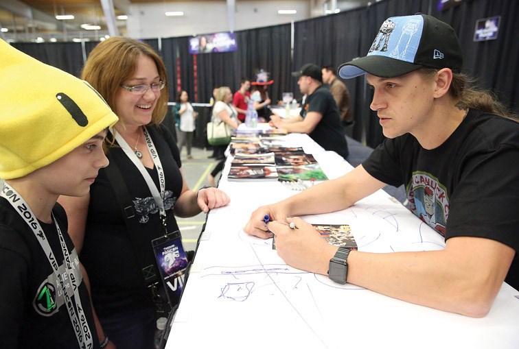 Ellen Bryden, and Aiden Bryden, 13, get an autograph from actor Jason Mewes on Friday during the opening day of the 2016 Northern FanCon. The second annual event took place on Friday, Saturday, and Sunday at CN Centre and the Kin Centres. Citizen Photo by James Doyle