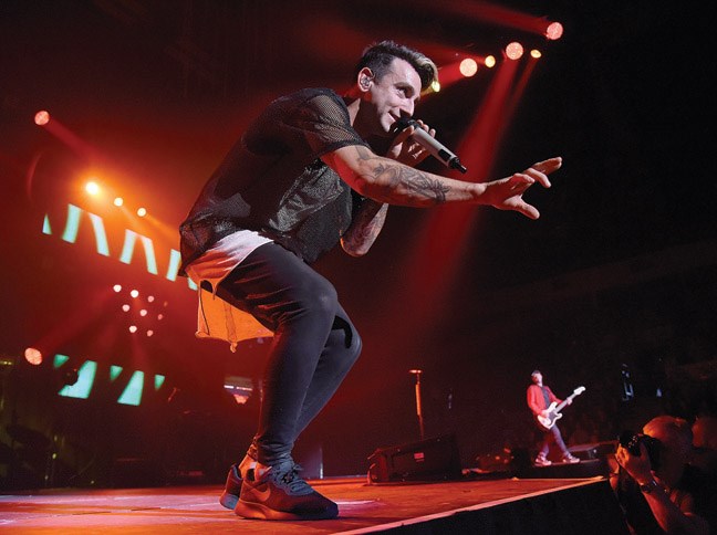 Jacob Hoggard, lead singer for Hedley, sings to a crowd of 3,700 at CN Centre Monday evening. The band is on their Hello World Tour.