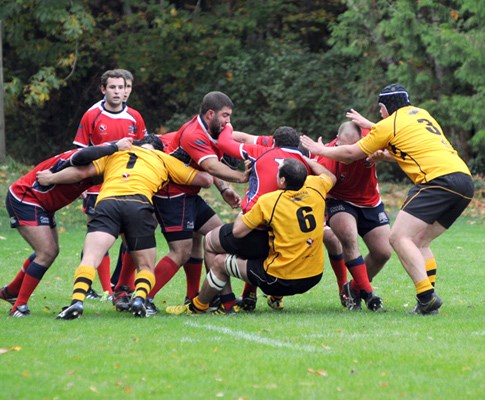 Action between Capilano's (yellow) and UBC Old Boy Ravens.