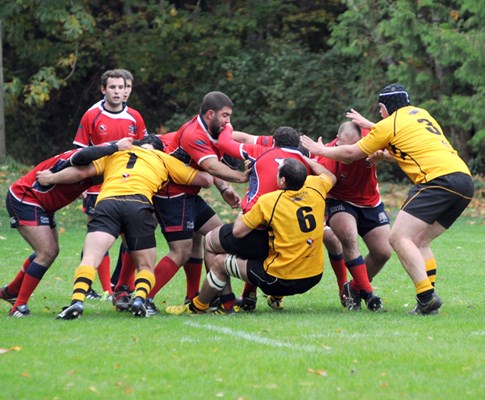 Action between Capilano's (yellow) and UBC Old Boy Ravens.
