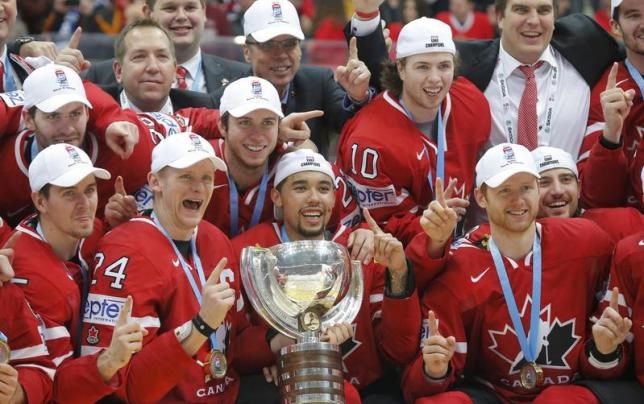 Chris Tanev and Ben Hutton celebrate gold with Team Canada