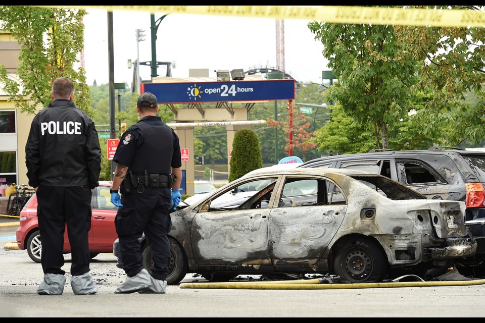 Police are investigating how a burned-out car and the shooting of a 28-year-old man in the parking lot of a McDonald's restaurant at Hastings and Cassiar are linked. Photo Dan Toulgoet