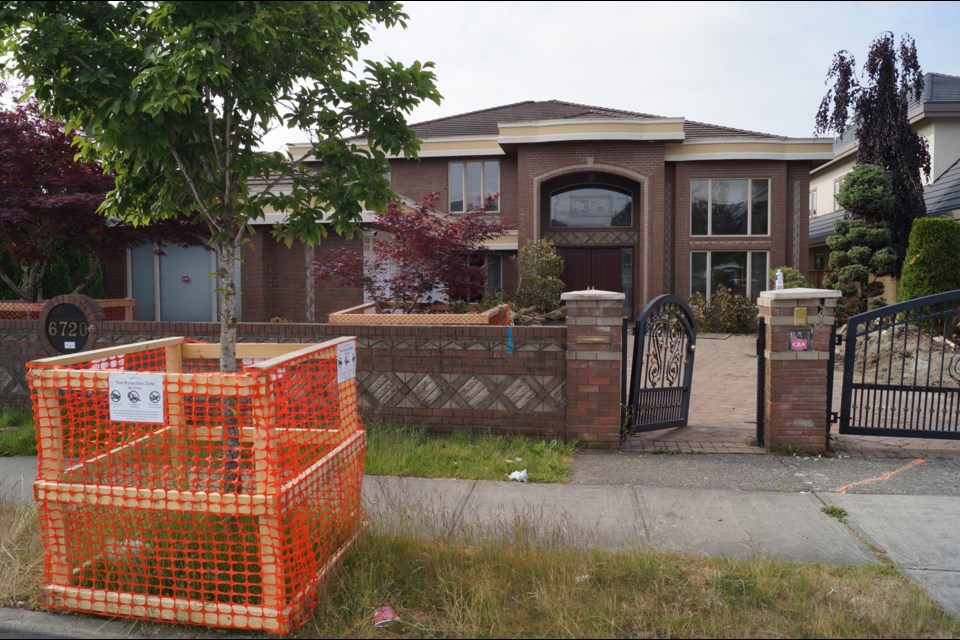 This home on Mang Road is being demolished. New homes along the road are selling for $5 million. May 2016.