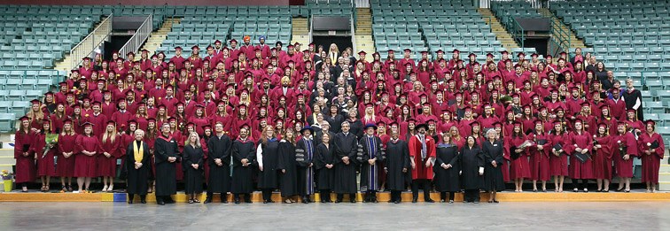 Graduates, faculty, and distingushed guests pose for a group photo on Saturday at CN Centre during College of New Caledonia Convocation 2016. Citizen Photo by James Doyle May 28, 2016