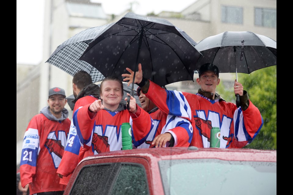 New Westminster Senior Salmonbellies wore big smiles (and carried umbrellas) for Saturday’s Hyack parade.