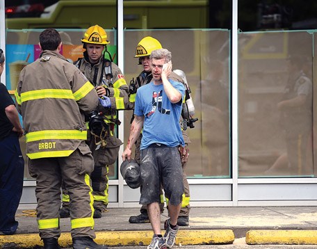 An injured floor layer outside of Second Cup in Parkwood Monday afternoon. Work being done inside caused a sewer gas explosion that caused huge bang that was heard at the Ambulance station at 15th Avenue and Edmonton Street. Citizen photo by Brent Braaten May 30 2016