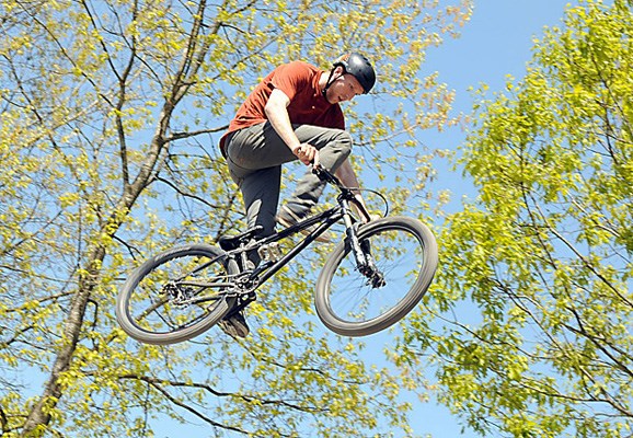 Competitors in the John Henry Days "Jump Jam " fly through the air during the 20th anniversary celebrations of the North Vancouver bike store.