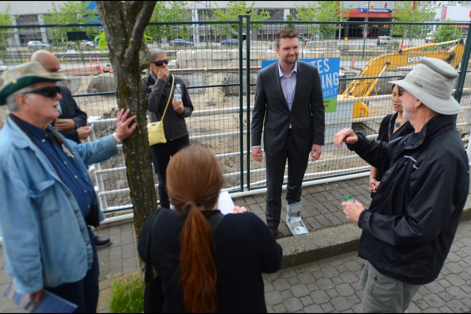 On-site chat: Wayne Vickers, development manager from Bosa Properties, chats with Quayside residents during a recent visit to the site.