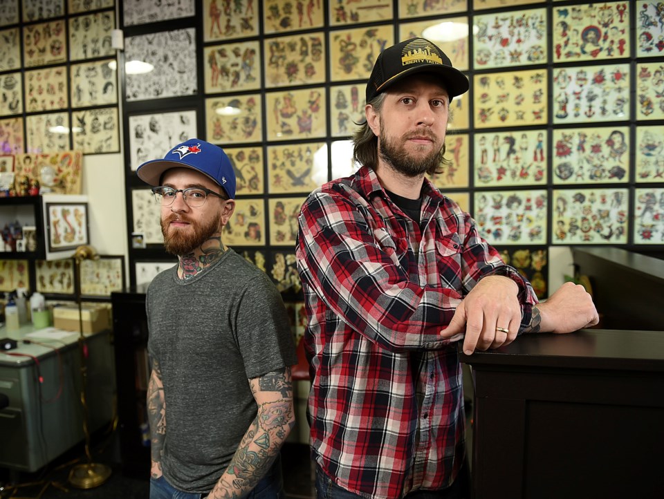 Nick Wasko (taller) and Jessy Hoffman say Palace Tattoo is intrinsically tied to the city’s history.