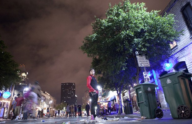 liftoff's lead singer Carmon Leeson scans Sixth Street in Austin, Texas at 3 a.m. on a Saturday night. Jonathan Fluevog documented the entire trip and is currently editing a 30-minute documentary of the band's adventures down south.