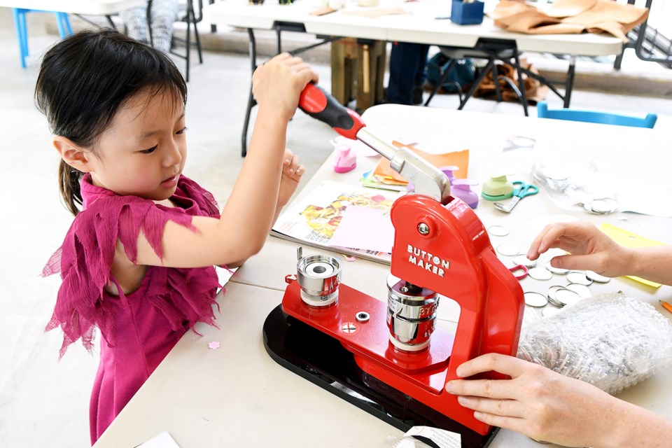Five-year-old Hanzi Yang gets creative at the Young Makers workshop.