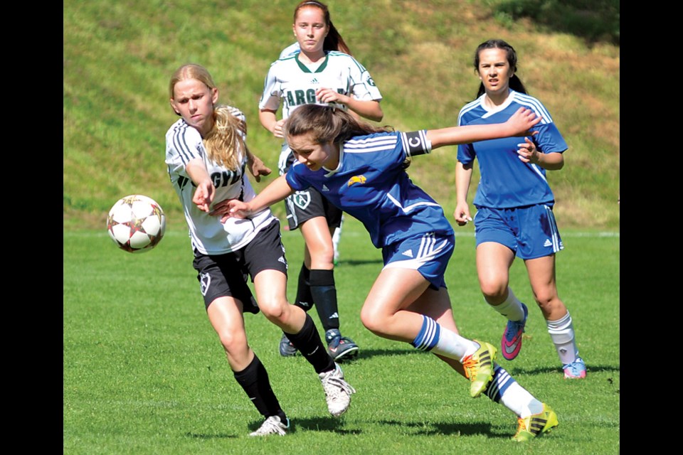 Handsworth’s Sophia Verdicchio nudges past an Argyle defender while teammate Jade Fraser follows the play during a North Shore league game. The Royals raced all the way to the provincial final last week before falling 1-0 against Surrey’s Fleetwood Park. photo by Paul McGrath, North Shore News