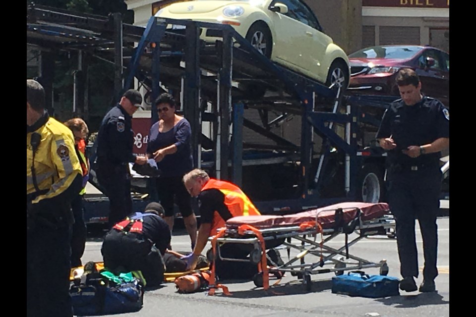 A pedestrian was taken to hospital after being struck by transport truck while in a crosswalk at Bay and Douglas streets on Thursday afternoon.