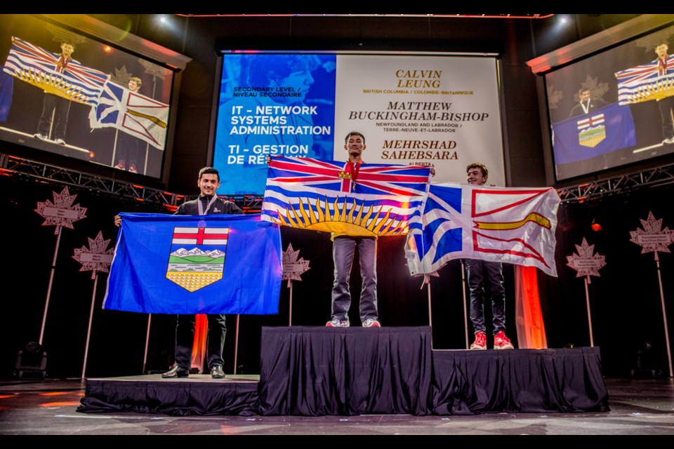 Burnaby Grade 12 student Calvin Leung accepts his gold medal for IT network systems administration at the 22nd annual Skills Canada National Competition in Moncton, N.B. this week.