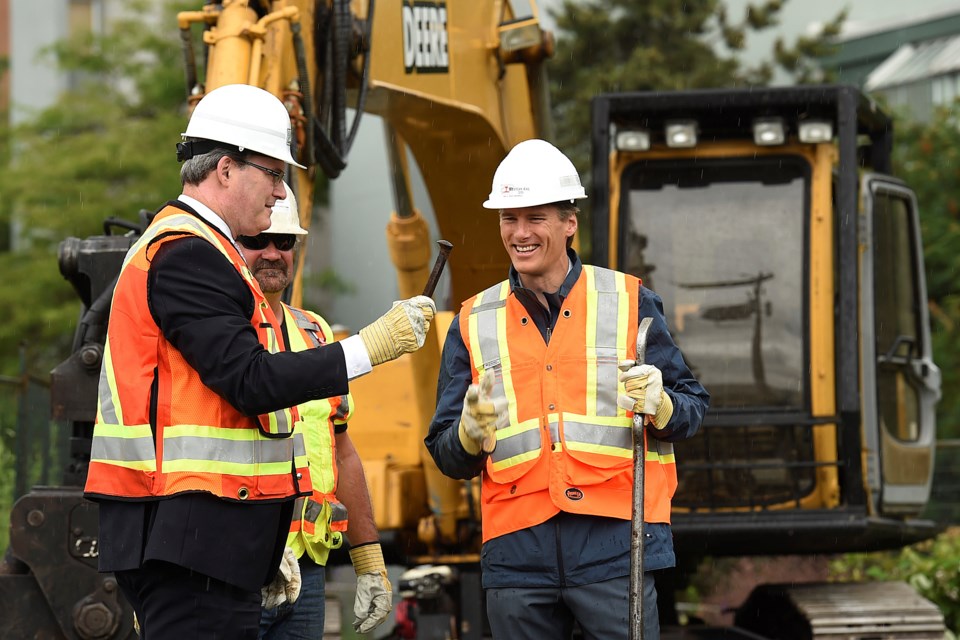 Jerry Dobrovolny, the city's general manager of engineering, holds the first spike he and Mayor Gregor Robertson removed the the Arbutus corridor railway. Photo Dan Toulgoet