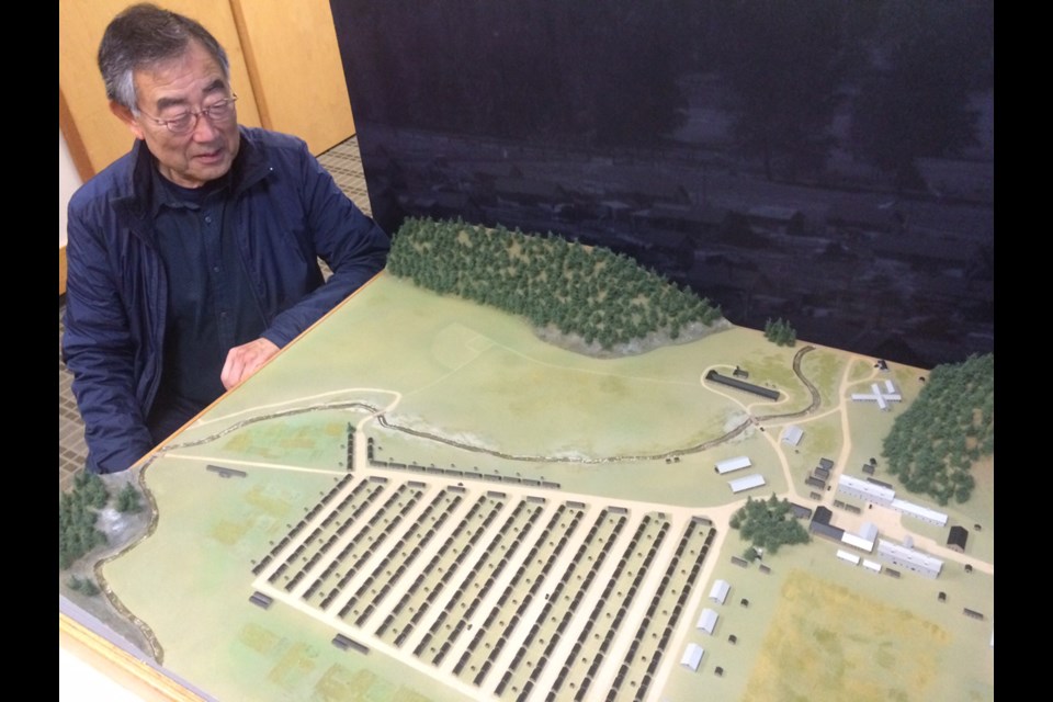 Howard Shimokura, 77, looks over a model of Tashme, B.C.'s largest and most isolated Japanese internment camp. Shimokura lived in the camp as a child and was part of the Tashme Historical Project, which culminated in the creation of tashme.ca, a site dedicated to capturing everyday life in the internment camp.